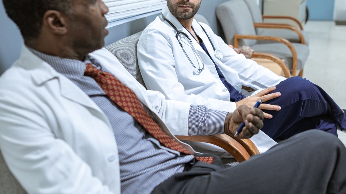 Two healthcare professionals having a one-on-one stay interview conversation